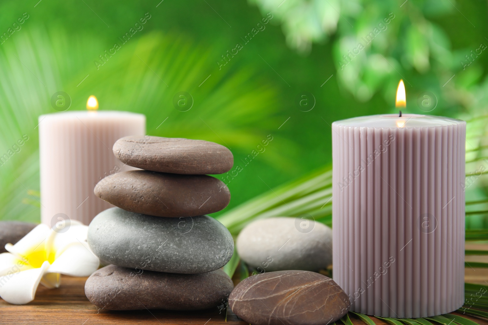 Photo of Composition with stones on table against blurred background. Zen concept