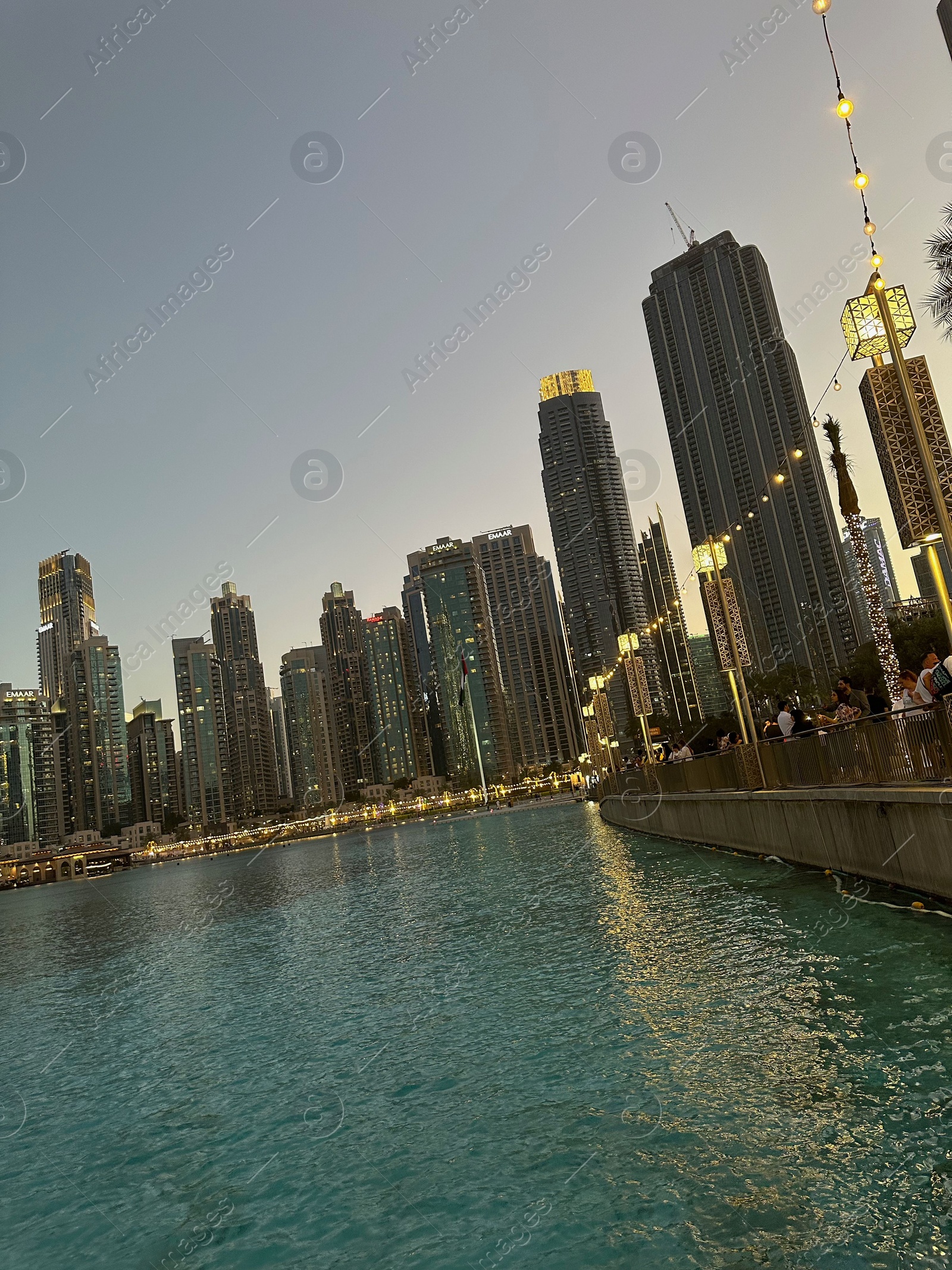 Photo of Dubai, United Arab Emirates - May 2, 2023: Beautiful modern buildings near embankment in city