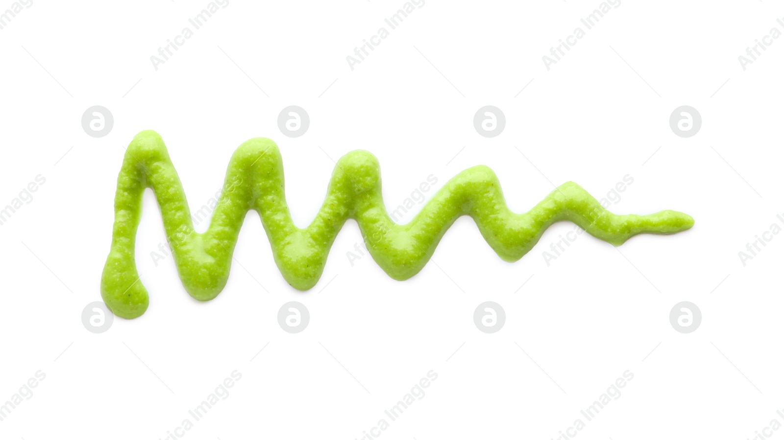 Photo of Stroke of delicious spicy wasabi paste isolated on white, top view