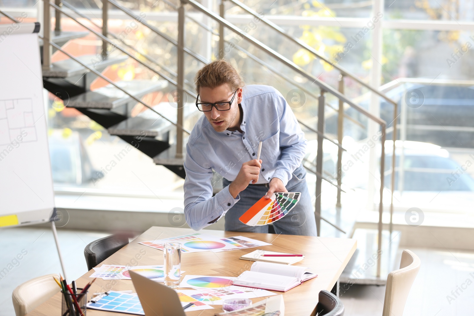 Photo of Professional interior designer at workplace in office