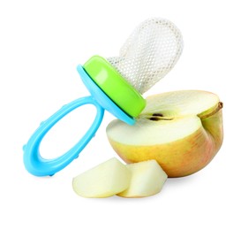Photo of Empty nibbler and cut apple on white background. Baby feeder