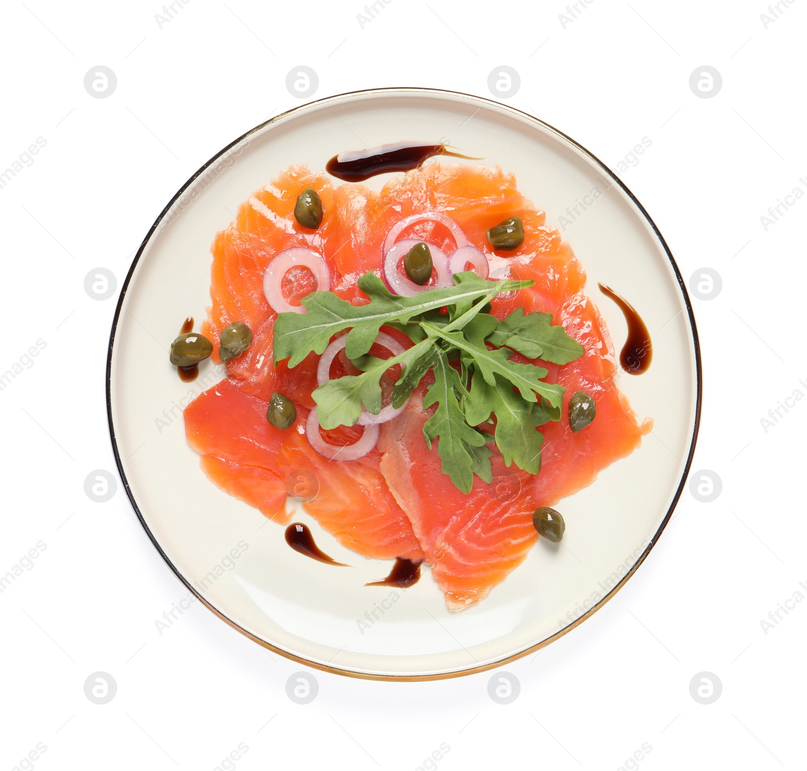 Photo of Delicious salmon carpaccio with arugula, capers and onion on white background, top view