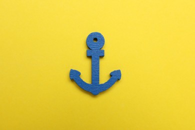 Anchor figure on yellow background, top view