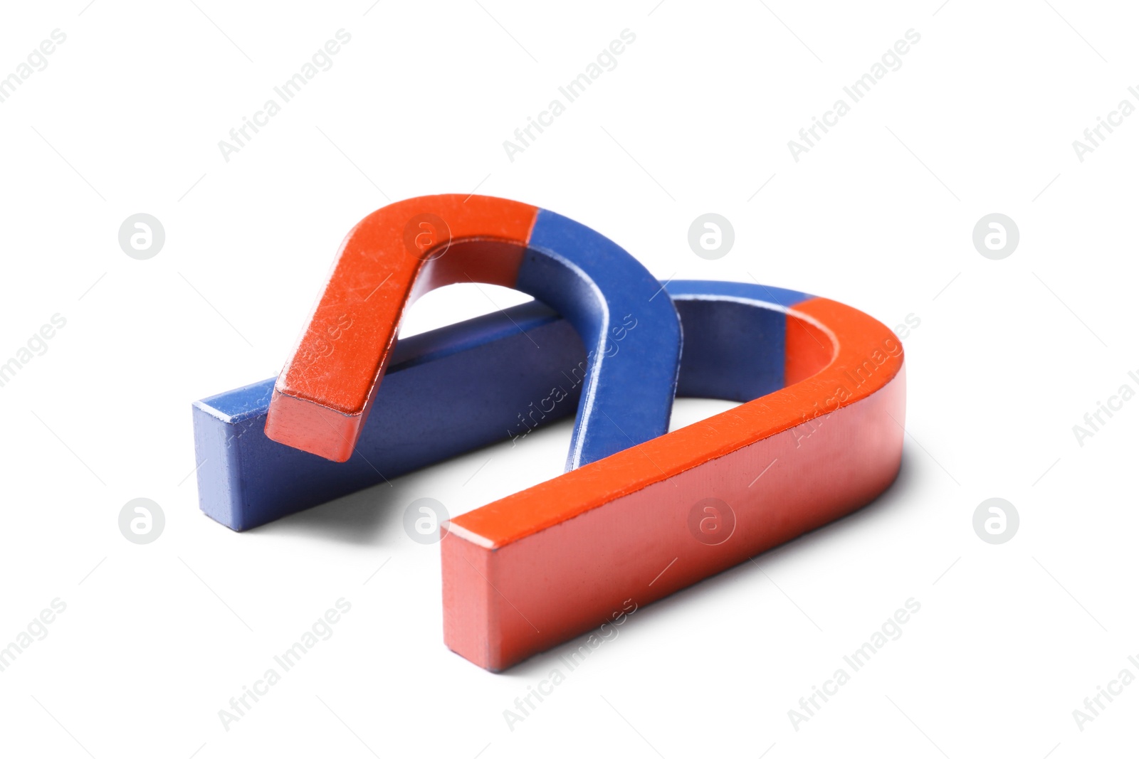 Photo of Red and blue horseshoe magnets on white background