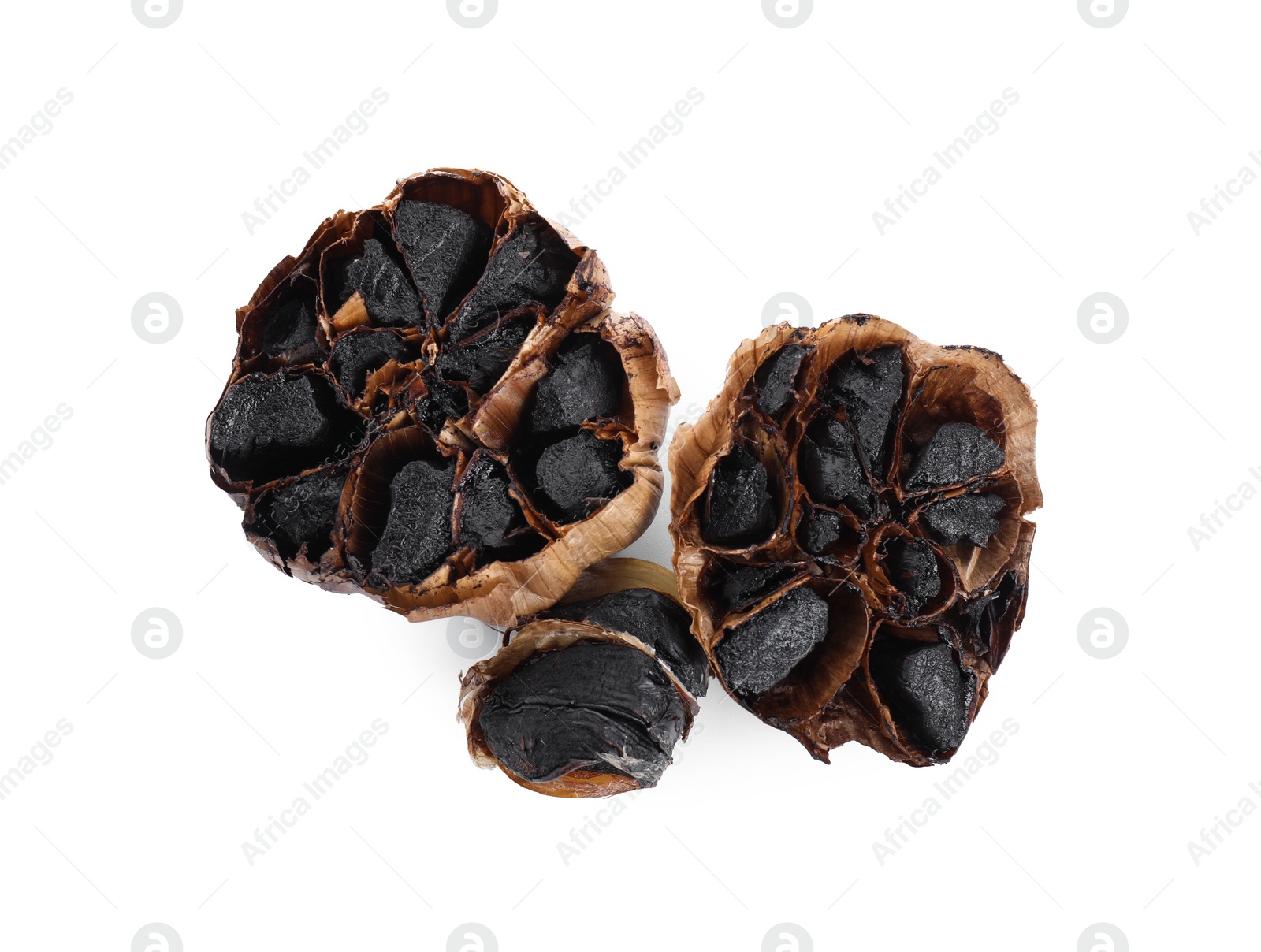 Photo of Organic fermented black garlic isolated on white, top view