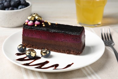 Photo of Delicious cake with blueberry on white wooden table, closeup