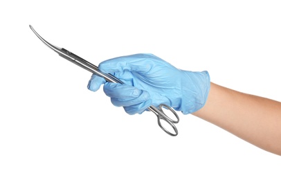 Doctor in medical glove holding surgical scissors on white background