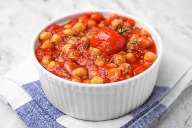 Delicious chickpea curry in bowl on table, closeup