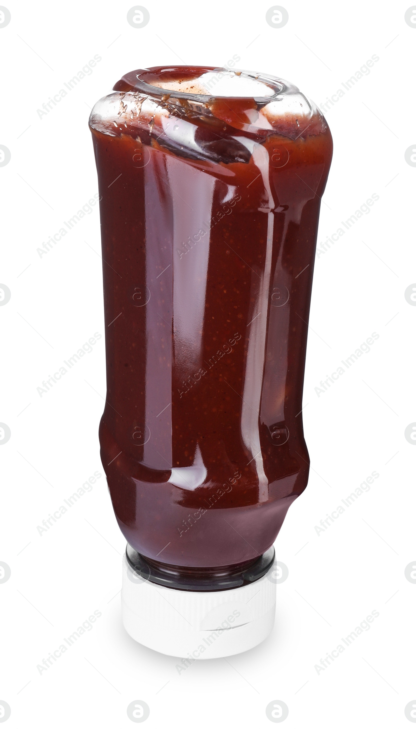 Photo of Bottle of tasty ketchup isolated on white