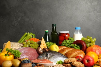 Photo of Different products on grey background. Healthy food and balanced diet