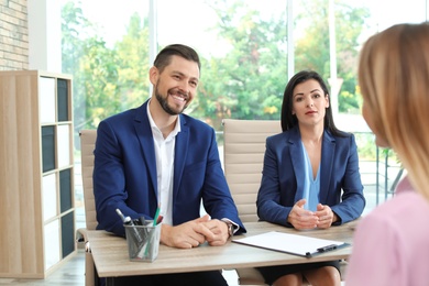 Photo of Human resources commission conducting job interview with applicant in office