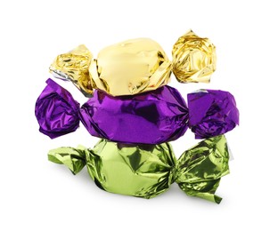 Photo of Stack of sweet candies in colorful wrappers on white background
