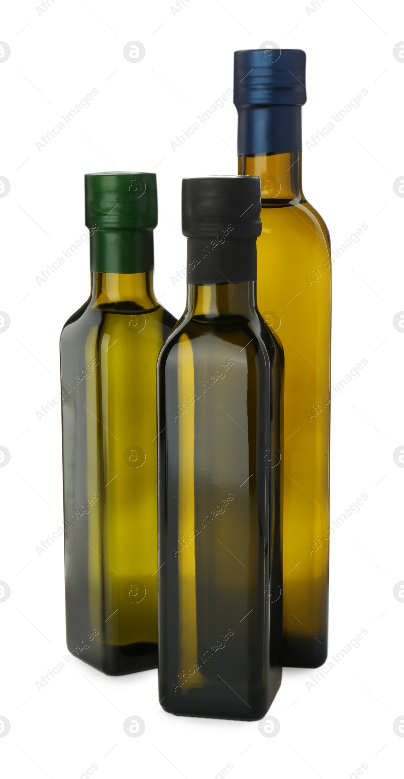 Photo of Vegetable fats. Cooking oils in glass bottles isolated on white