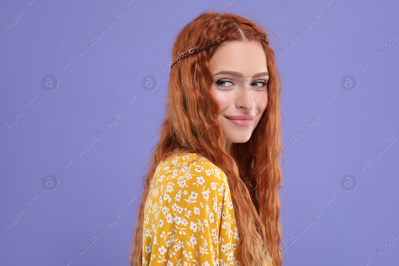 Photo of Beautiful young hippie woman on violet background