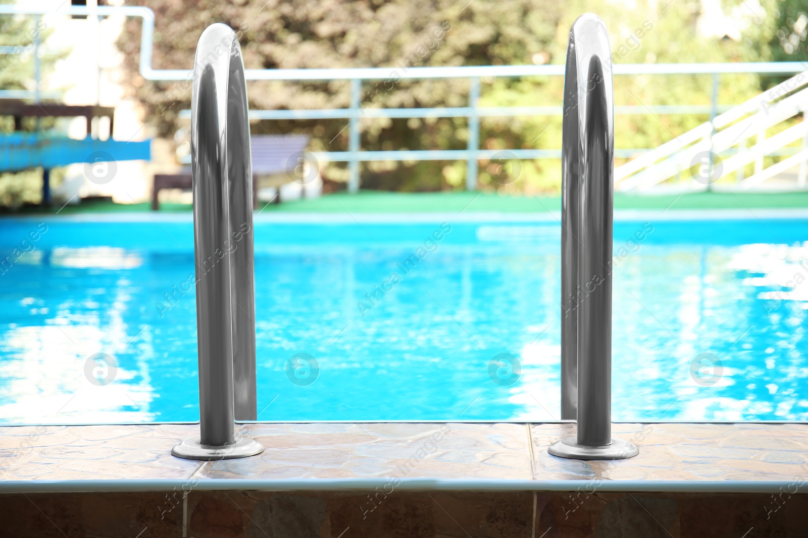 Photo of Modern swimming pool with stairs at resort