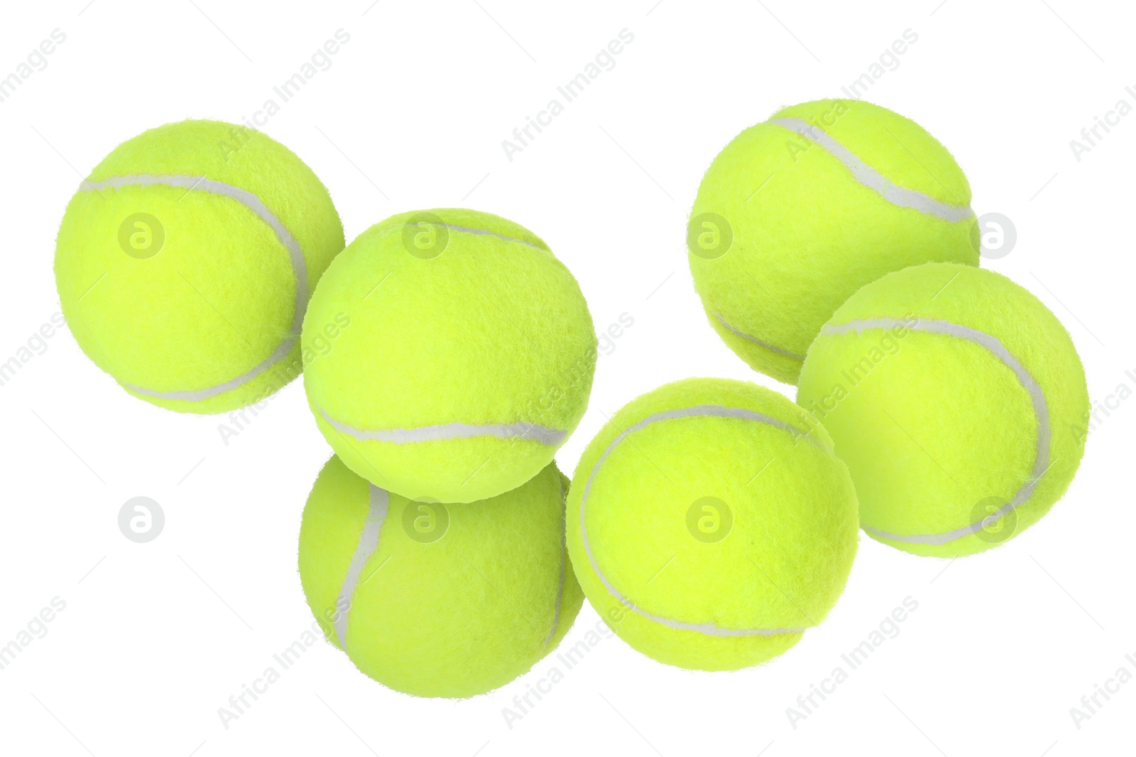 Image of Many tennis balls flying on white background