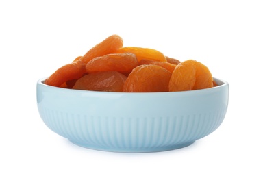 Bowl with apricots on white background. Dried fruit as healthy food