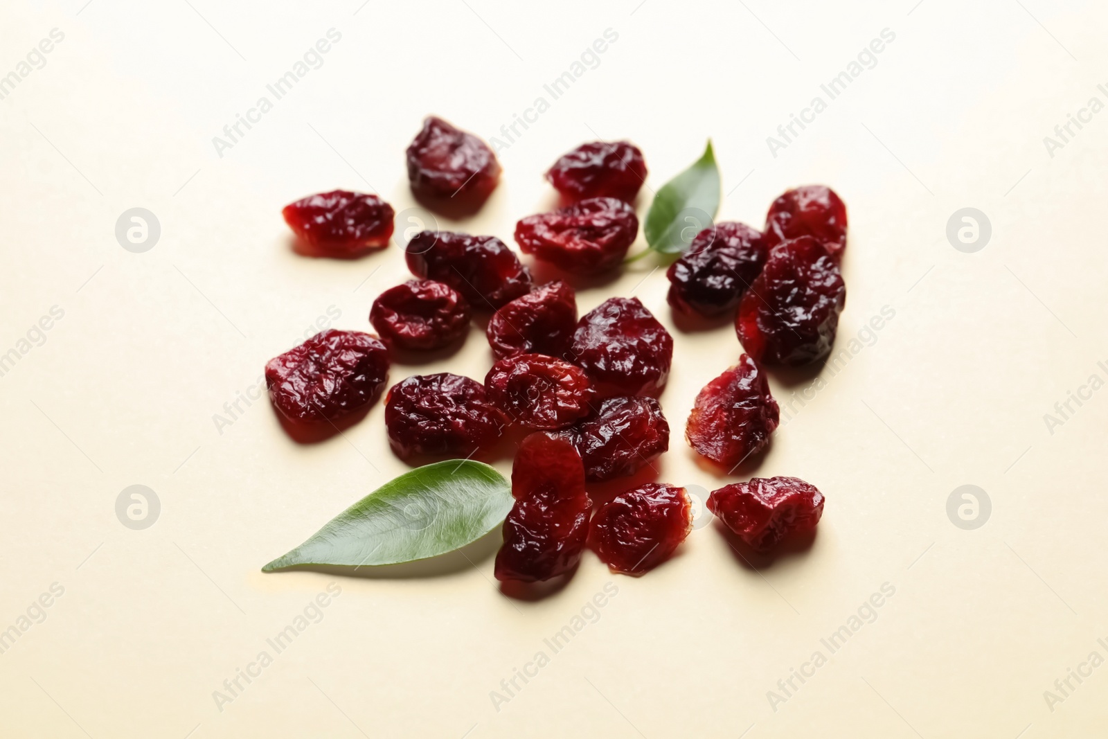 Photo of Cranberries on color background. Dried fruit as healthy snack