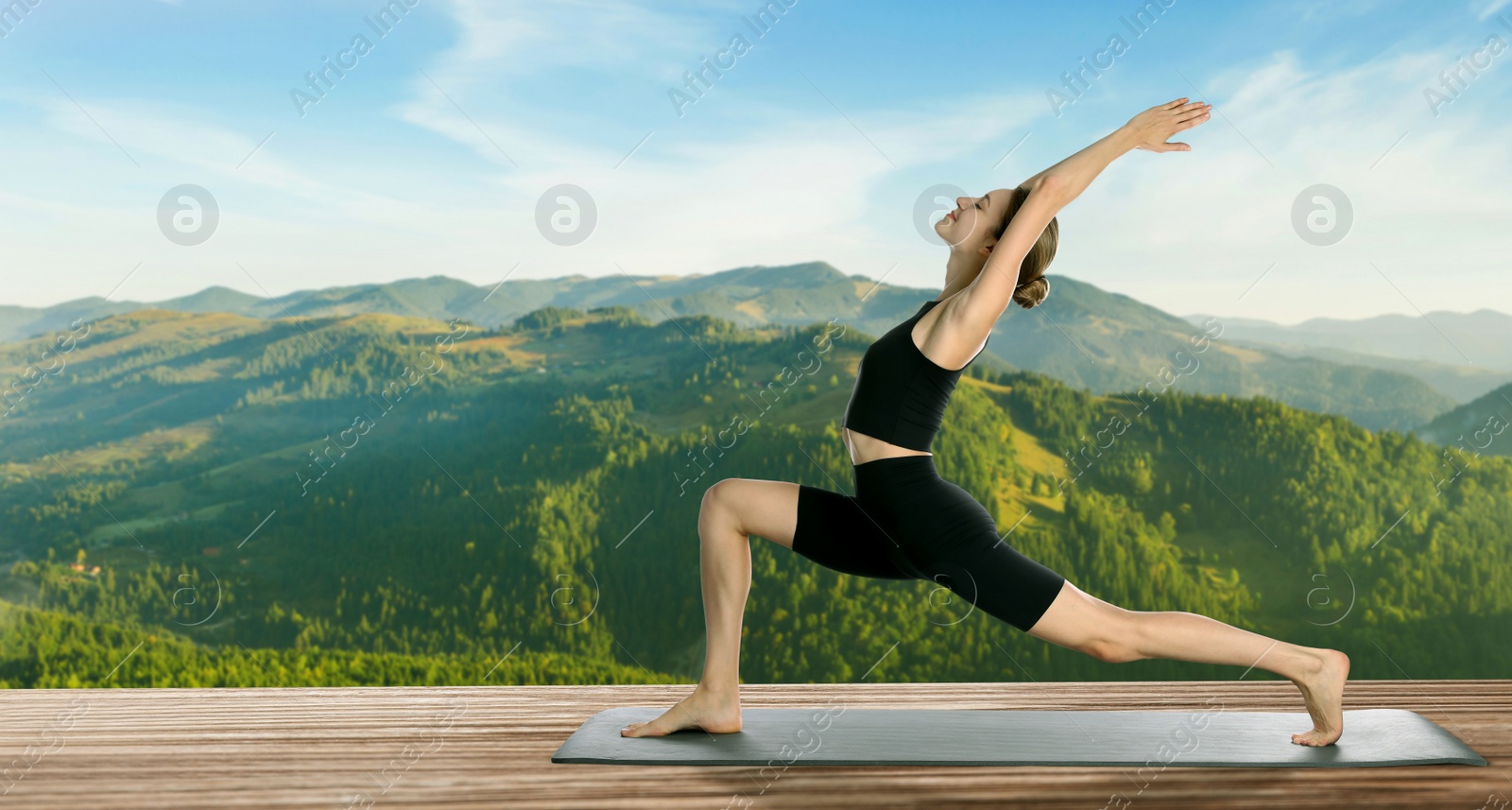 Image of Young woman practicing yoga on wooden surface against beautiful mountain landscape, space for text. Banner design