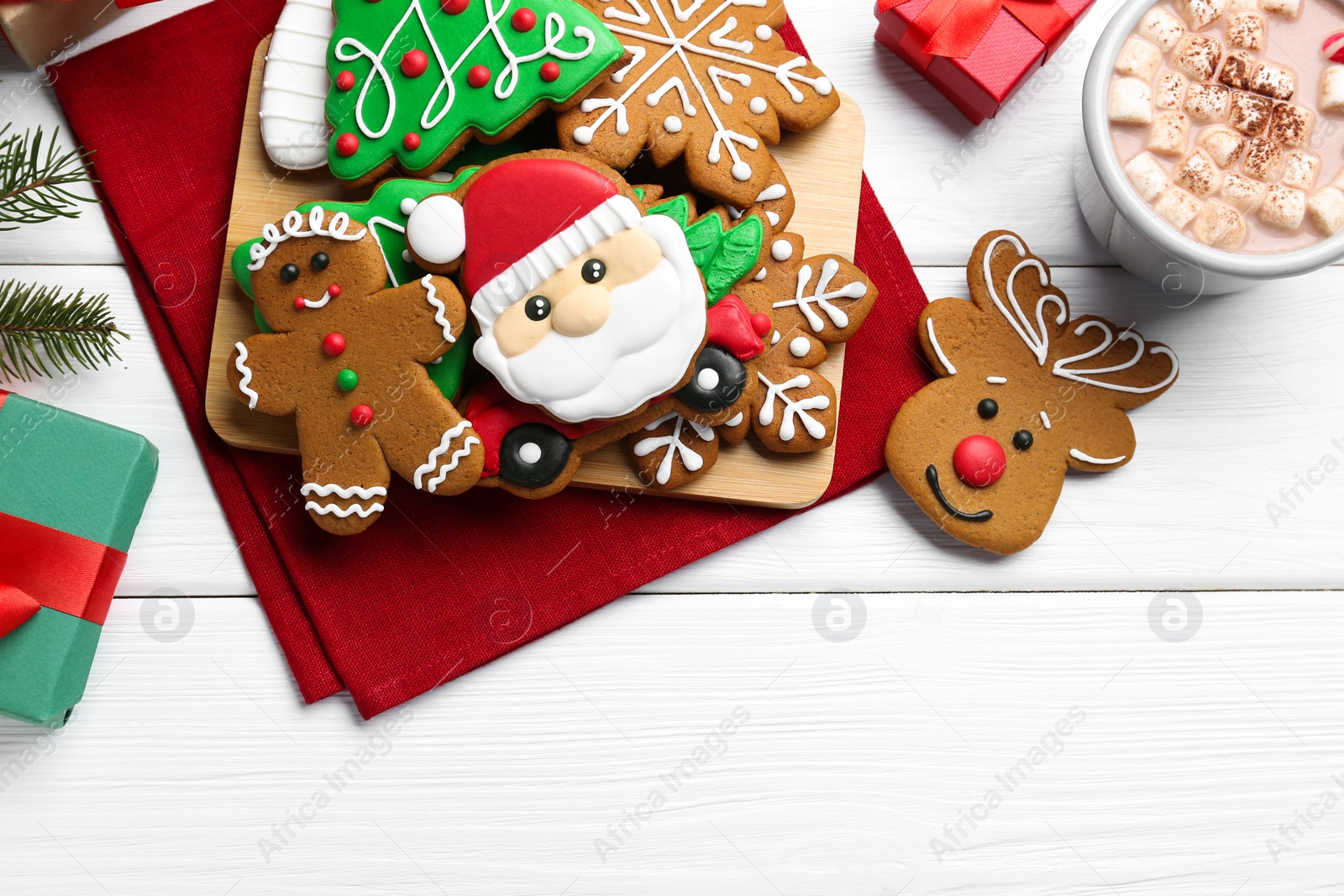 Photo of Flat lay composition with tasty homemade Christmas cookies on white wooden table. Space for text