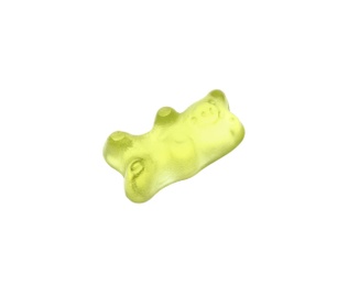 Photo of Delicious yellow jelly bear on white background