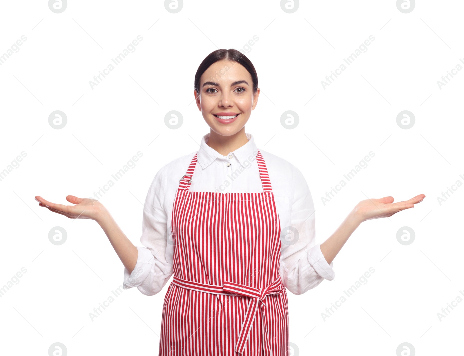 Photo of Young woman in red striped apron on white background