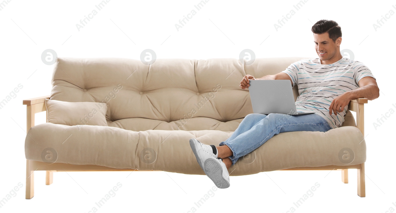 Photo of Man with laptop on comfortable sofa against white background