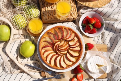 Photo of Blanket with different products, flat lay. Summer picnic