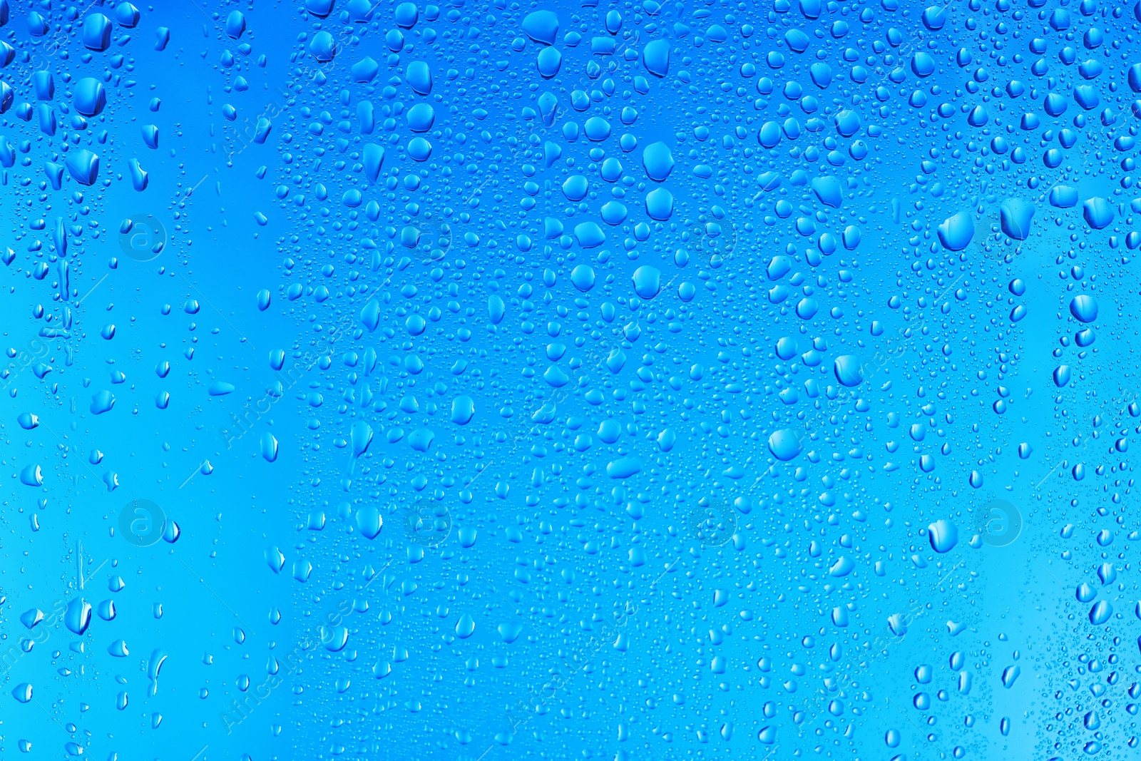 Photo of View of glass with water drops, closeup