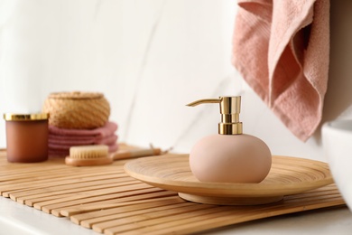 Photo of Different toiletries on white table in bathroom. Space for text