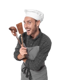 Photo of Professional chef with kitchen tools on white background