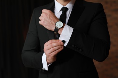 Man wearing stylish suit and cufflinks, closeup view
