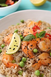 Tasty rice with shrimps and vegetables in bowl, closeup