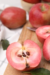 Photo of Tasty apples with red pulp on table, closeup