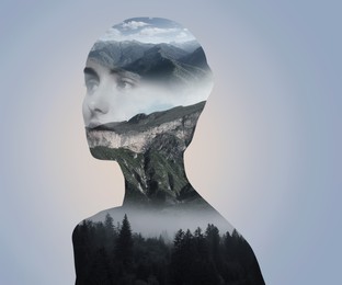 Image of Double exposure of beautiful woman and foggy mountains