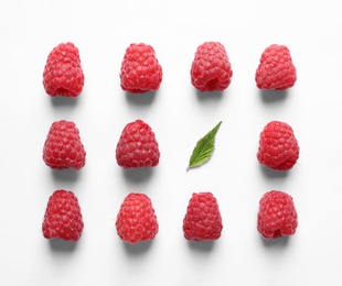 Photo of Fresh sweet ripe raspberries on white background, flat lay