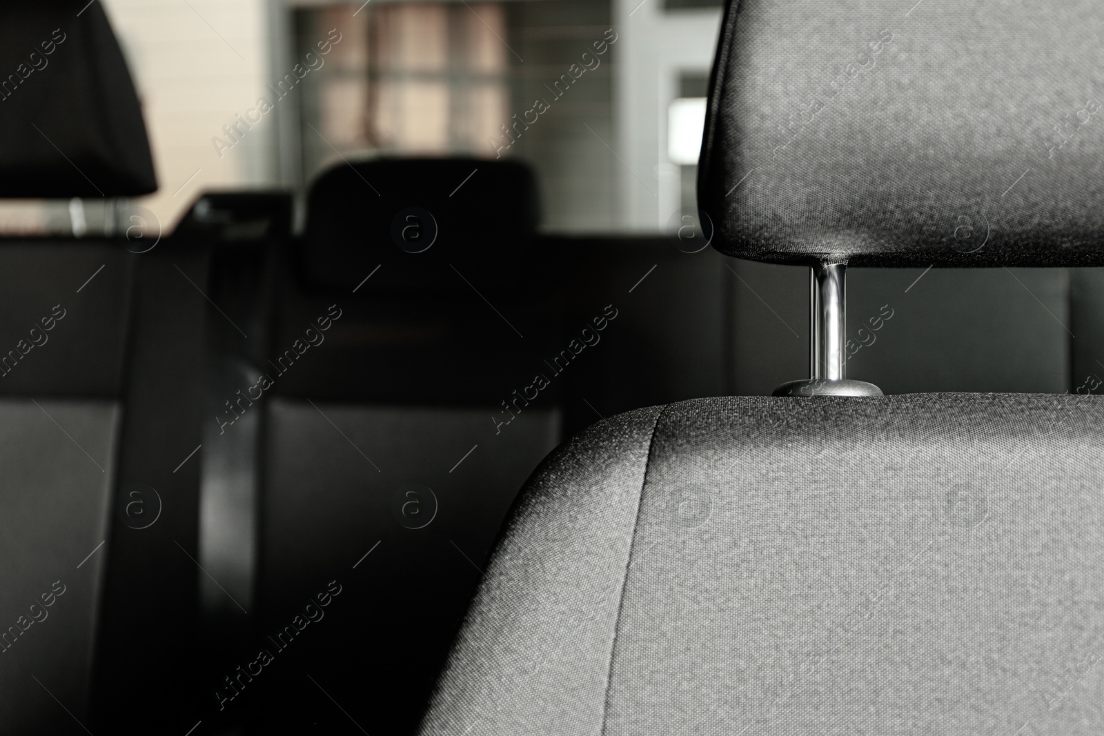 Photo of Car seat with grey upholstery, closeup view