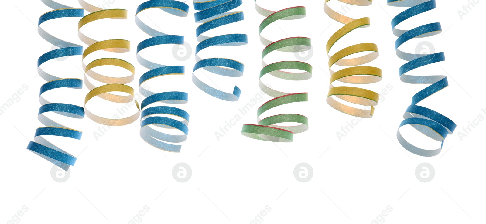 Photo of Bright serpentine streamers on white background. Festive decor