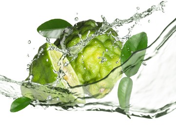 Image of Fresh ripe bergamot fruits, green leaves and splashing water on white background