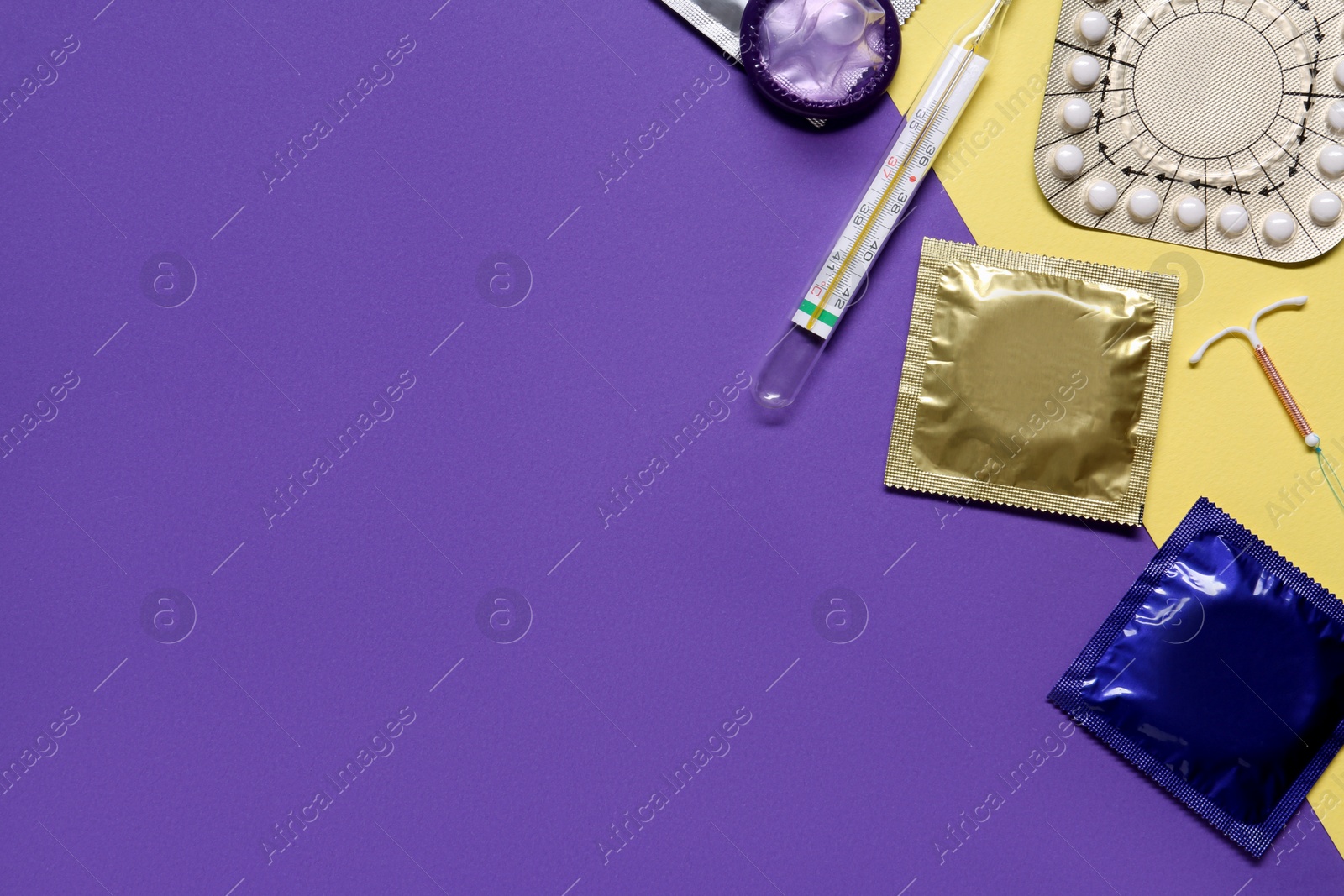 Photo of Contraceptive pills, condoms, intrauterine device and thermometer on color background, flat lay with space for text. Different birth control methods