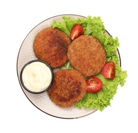 Plate with delicious vegan cutlets, lettuce, tomatoes and sauce isolated on white, top view