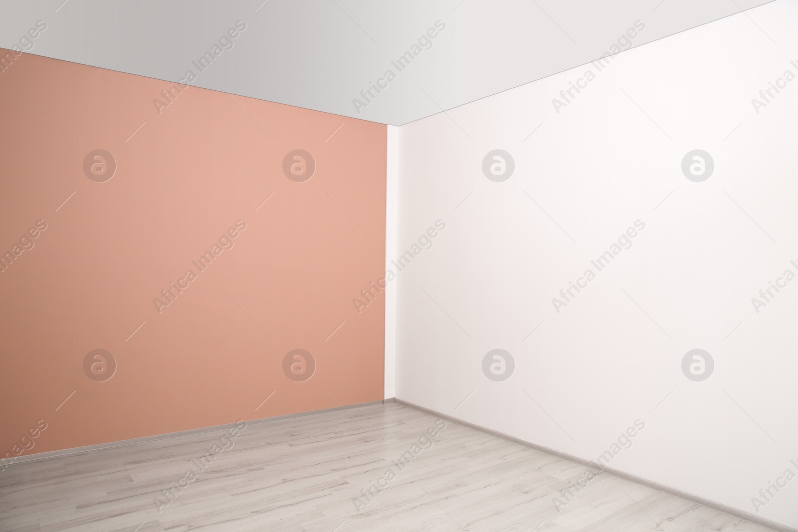 Photo of Empty room with different walls and laminated floor