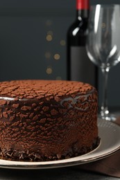 Photo of Delicious chocolate truffle cake on table, closeup
