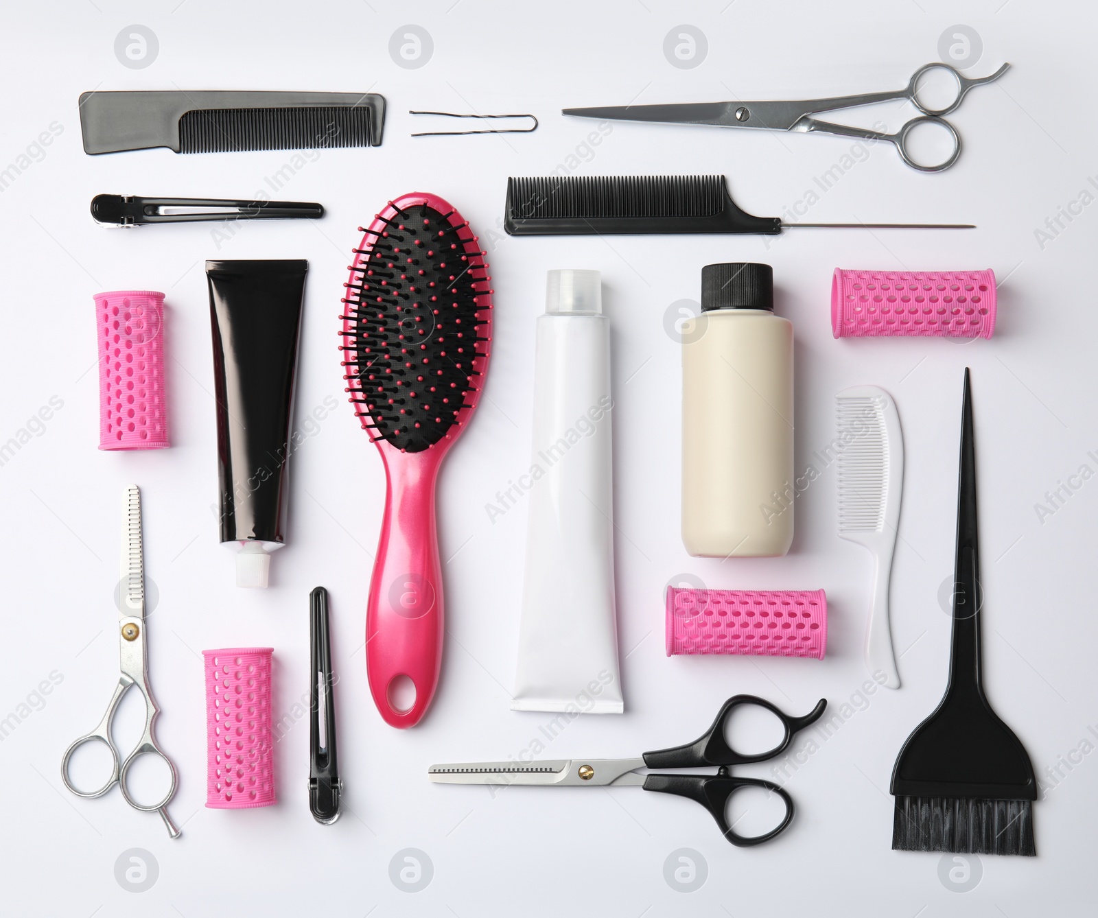 Photo of Professional tools for hair dyeing on white background, flat lay