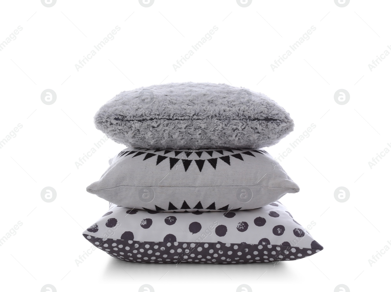 Photo of Stack of different colorful pillows on white background