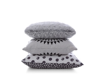 Stack of different colorful pillows on white background