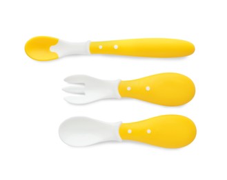 Photo of Plastic cutlery on white background, top view. Serving baby food
