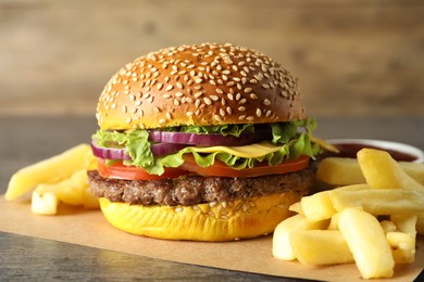 Photo of Burger with delicious patty and french fries on table, closeup