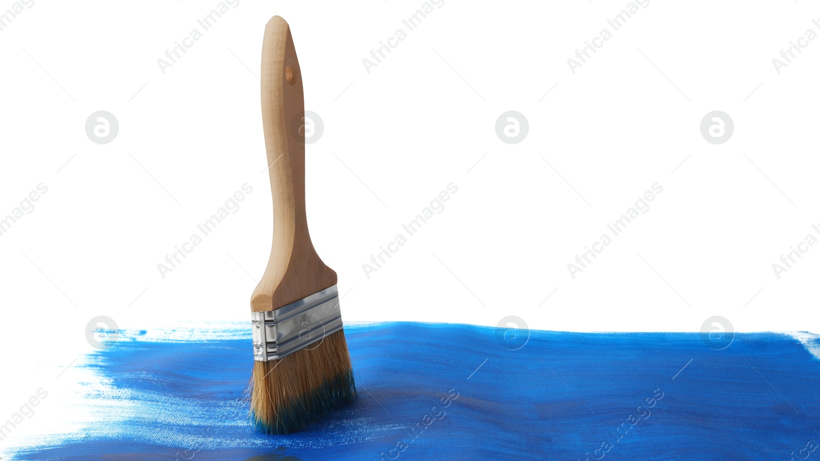 Photo of Blue paint stroke and brush on white background