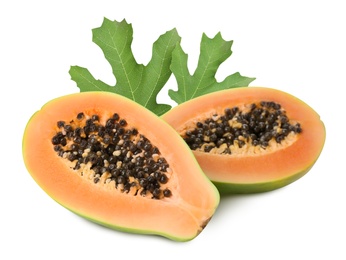 Fresh ripe papaya fruit and green leaves on white background